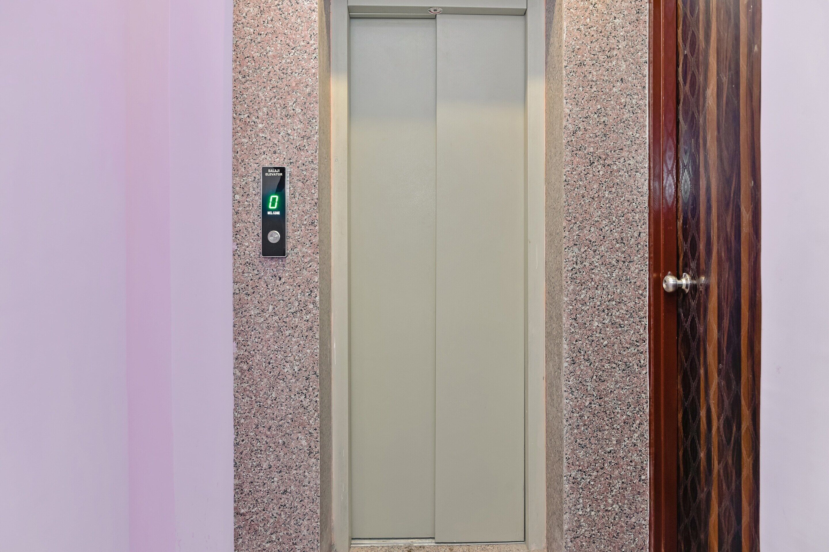 An elevator with a digital display indicating the floor number.