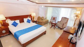Deluxe Double Room, Partial Lake View | 1 bedroom, desk, laptop workspace, blackout drapes