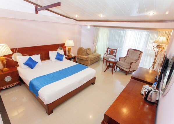 Deluxe Double Room, Partial Lake View | 1 bedroom, desk, laptop workspace, blackout drapes