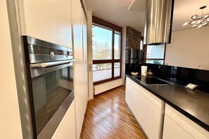 Premium Apartment, 1 Bedroom, Balcony, City View | Private kitchenette | Full-sized fridge, oven, stovetop, dishwasher