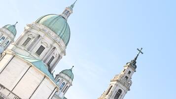 A church with multiple domes and a tall bell tower.