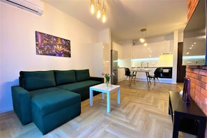 Premium Apartment, 1 Bedroom, Terrace, City View | Living area | 42-inch flat-screen TV with cable channels