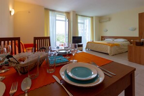 Family Studio, Balcony | In-room dining