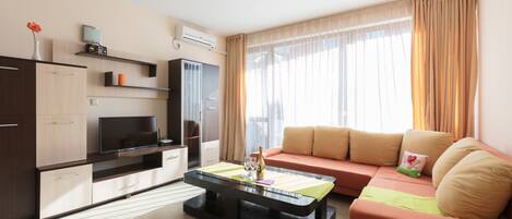 Family Studio, Balcony | Living area | TV