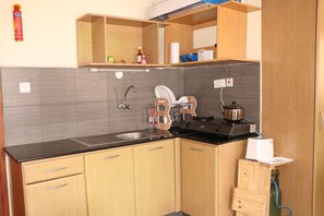 Comfort Apartment, 1 King Bed, Smoking, City View | Private kitchen | Fridge, microwave, electric kettle, cookware/dishes/utensils - Studio 254 (Nairobi)