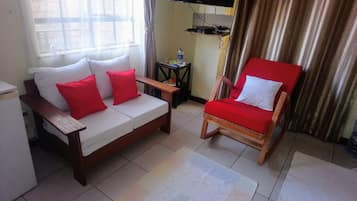 Comfort Apartment, 1 Queen Bed | Living area | Flat-screen TV