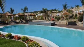 Seasonal outdoor pool, open 9:00 AM to 9:00 PM, free cabanas