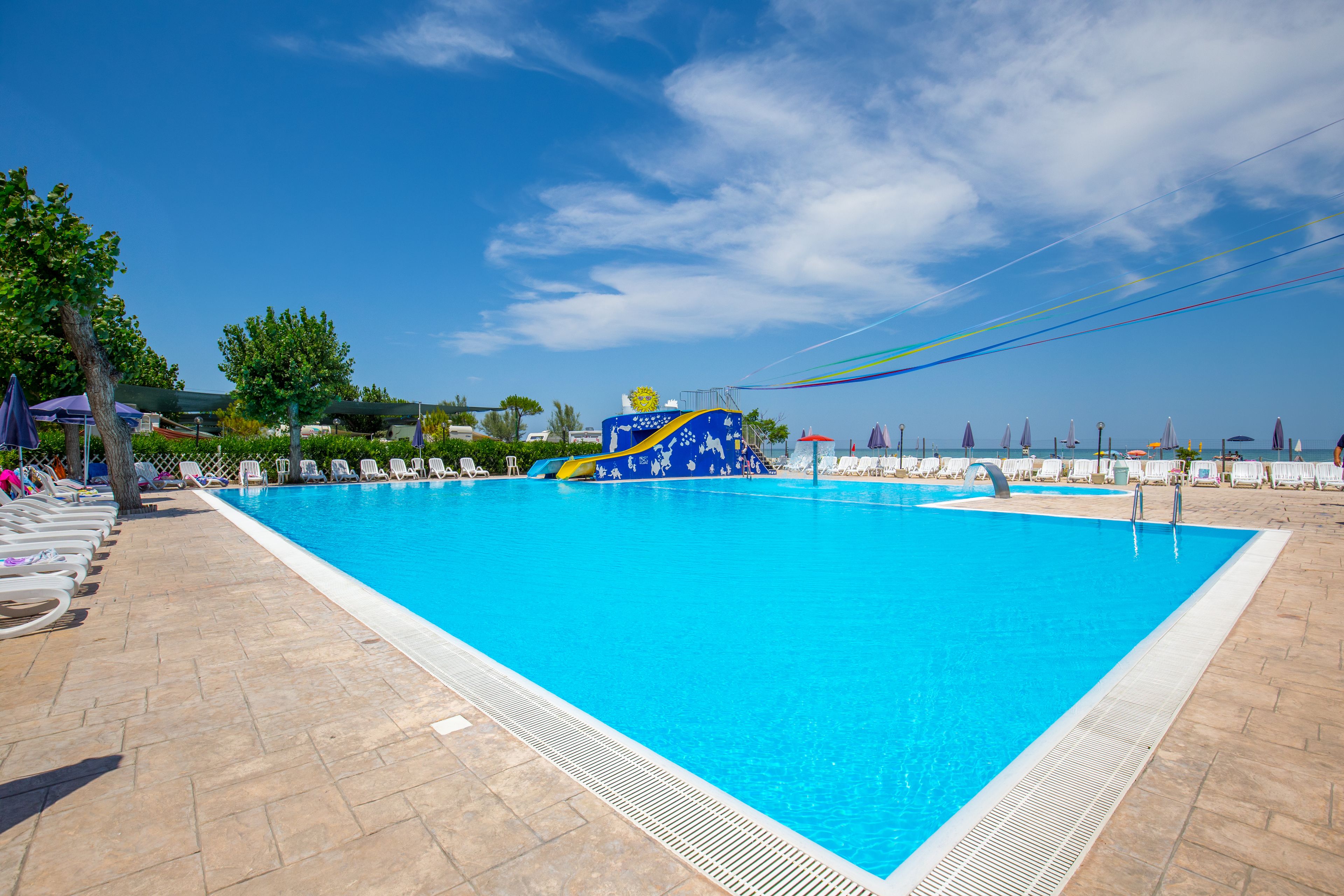Seasonal outdoor pool, open 9:00 AM to 7:00 PM, pool umbrellas