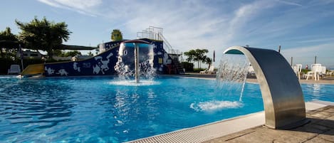 Seasonal outdoor pool, open 9:00 AM to 7:00 PM, pool umbrellas