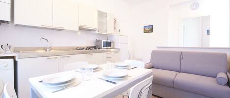 Apartment, 1 Bedroom | Living room | Flat-screen TV