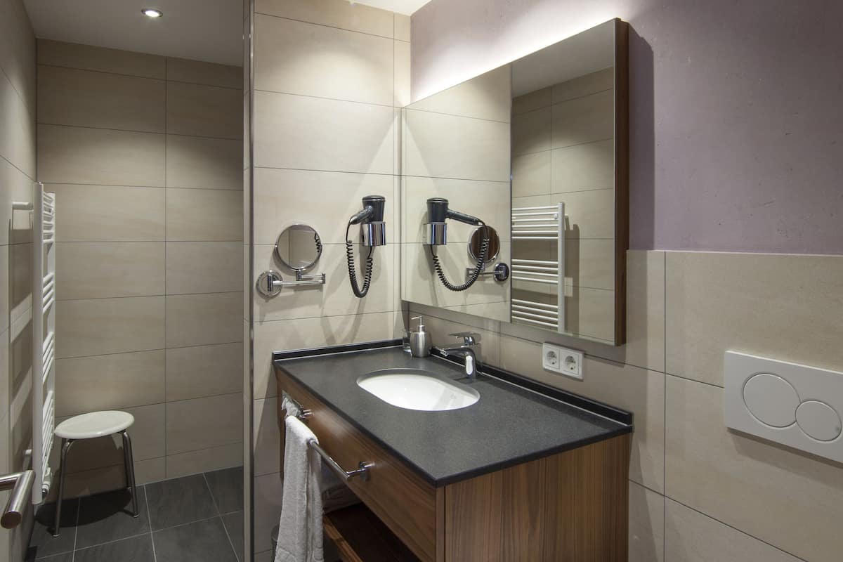 shower, rainfall showerhead, hair dryer, towels