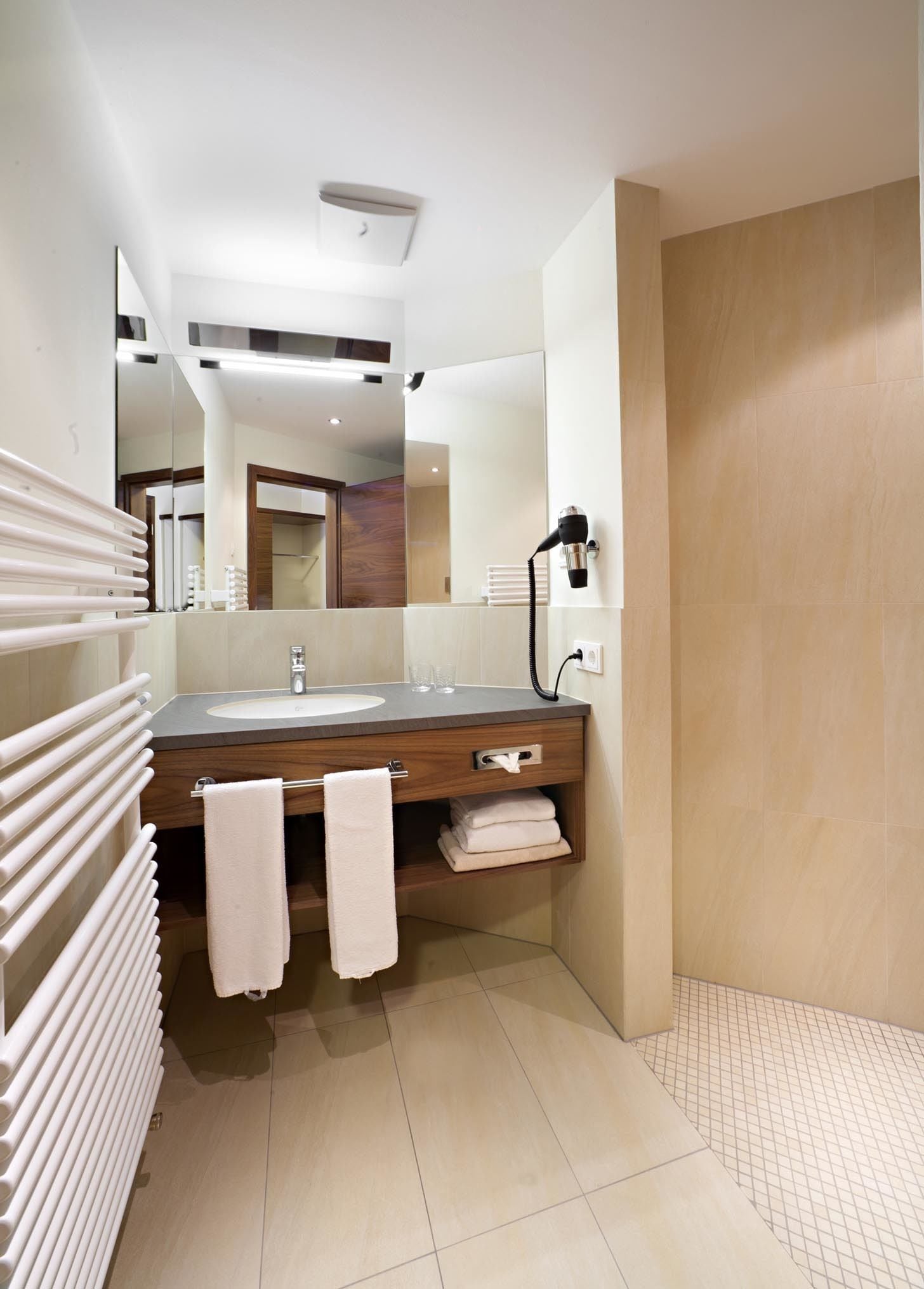 shower, rainfall showerhead, hair dryer, towels