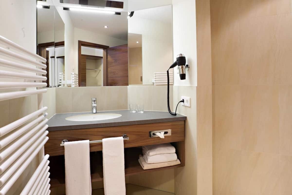 shower, rainfall showerhead, hair dryer, towels