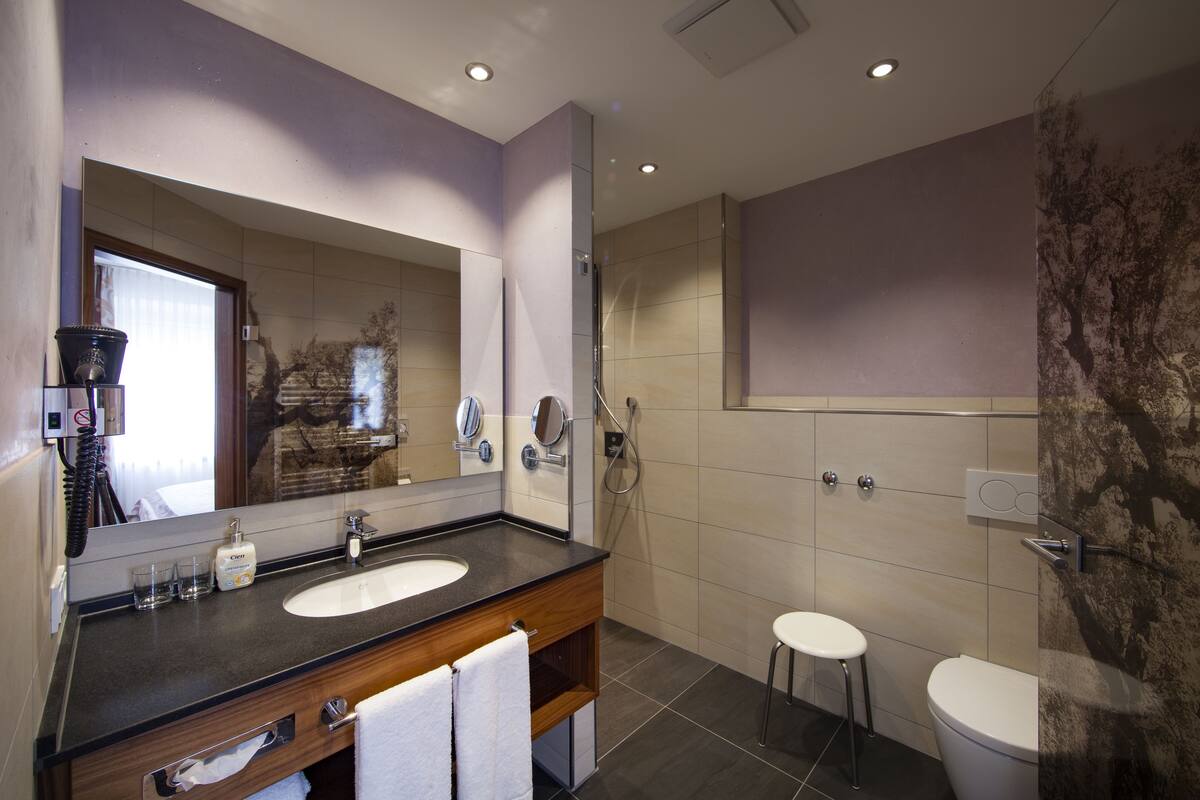 shower, rainfall showerhead, hair dryer, towels