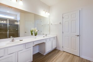 A bathroom with a white vanity, a large mirror, and a shower. - H6104beautiful 14bedroom 11bathroom Sleeps 30villa (Davenport)