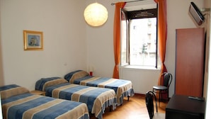 A room with four single beds, a desk, a chair, and a window with curtains. - B&B Citta Studi (Milan)