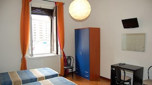 A room with two beds, a desk, a chair, a wardrobe, and a TV on the wall. - B&B Citta Studi (Milan)