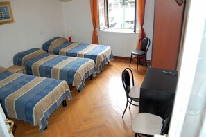 A room with two beds, a desk, and a chair. - B&B Citta Studi (Milan)