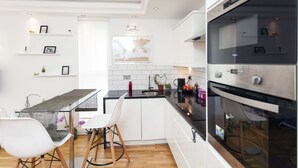 Apartment, 1 Bedroom | Private kitchen | Coffee/tea maker, full-size fridge, microwave, oven - Chelsea Stamford Bridge Atmosphere (London)