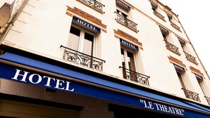 A hotel facade with "HOTEL" signs above windows and "LE THEATRE" on the awning. - Le Theatre (Suresnes)