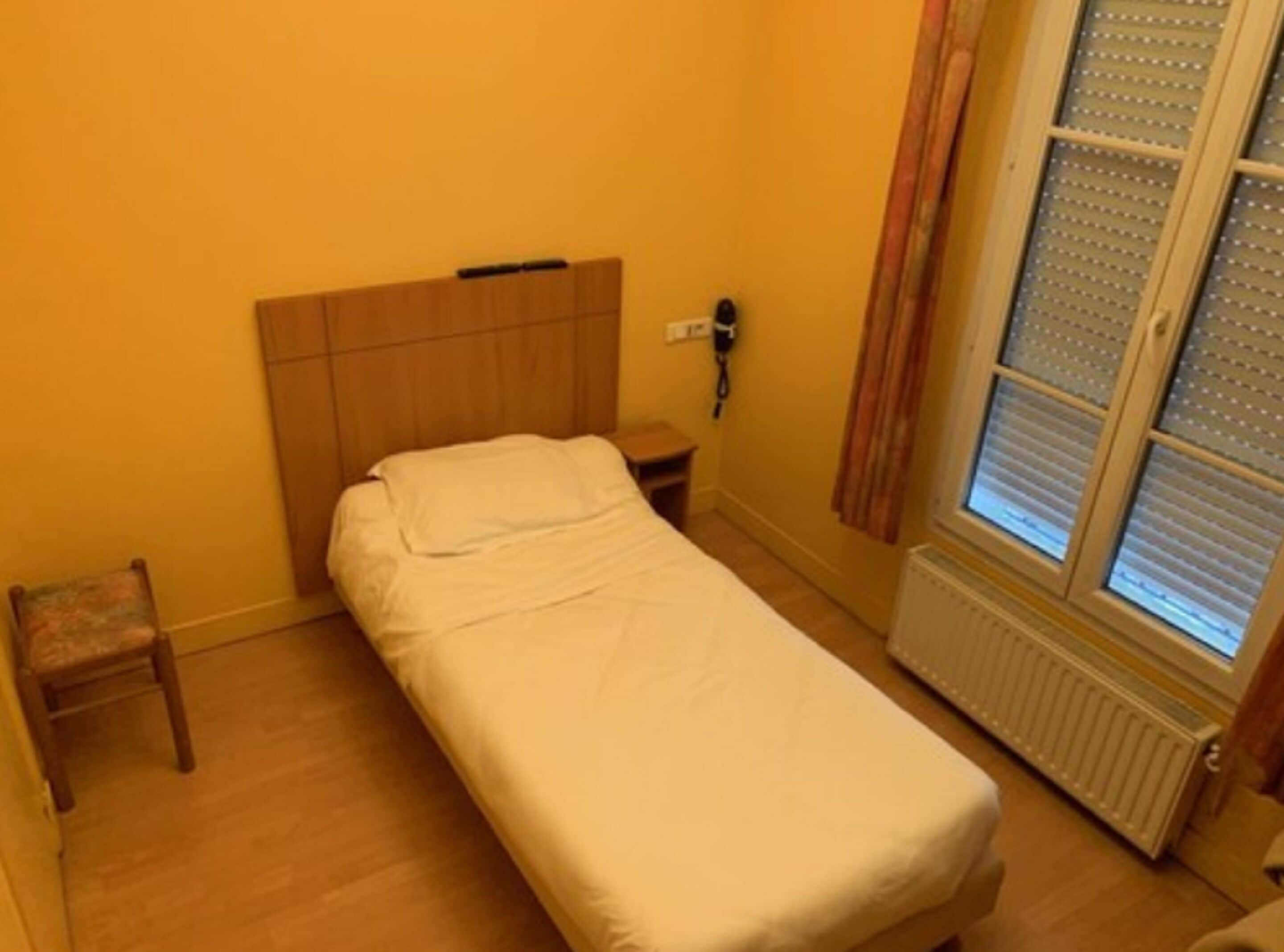 economy single room, 1 single bed, non smoking, city view | individually decorated, individually furnished, desk, blackout curtains