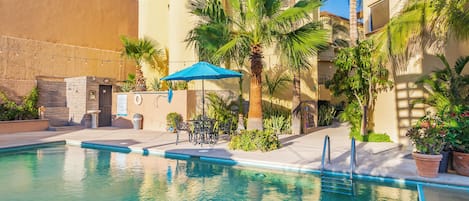 Outdoor pool, pool umbrellas, sun loungers