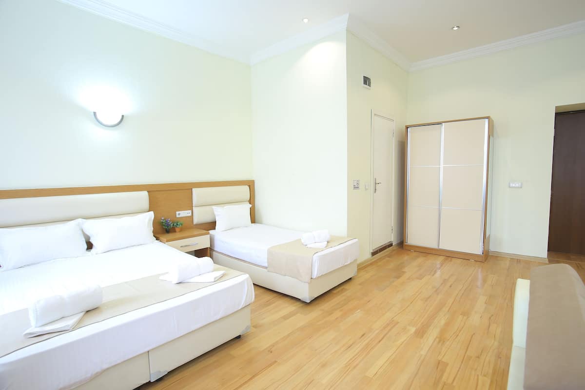 Family Room, Balcony | Minibar, in-room safe, individually decorated, desk