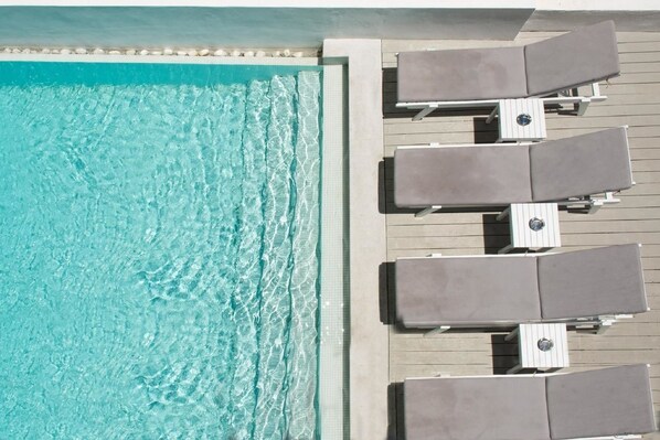 Seasonal outdoor pool, pool umbrellas, pool loungers