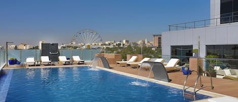 Outdoor pool, open 6:00 AM to 11:30 PM, pool loungers