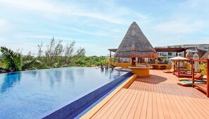 2 outdoor pools, open 9:00 AM to 8:00 PM, pool umbrellas, pool loungers