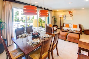 Deluxe Apartment, Kitchen, Pool View | Dining room