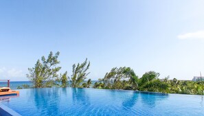2 outdoor pools, open 9:00 AM to 8:00 PM, pool umbrellas, pool loungers