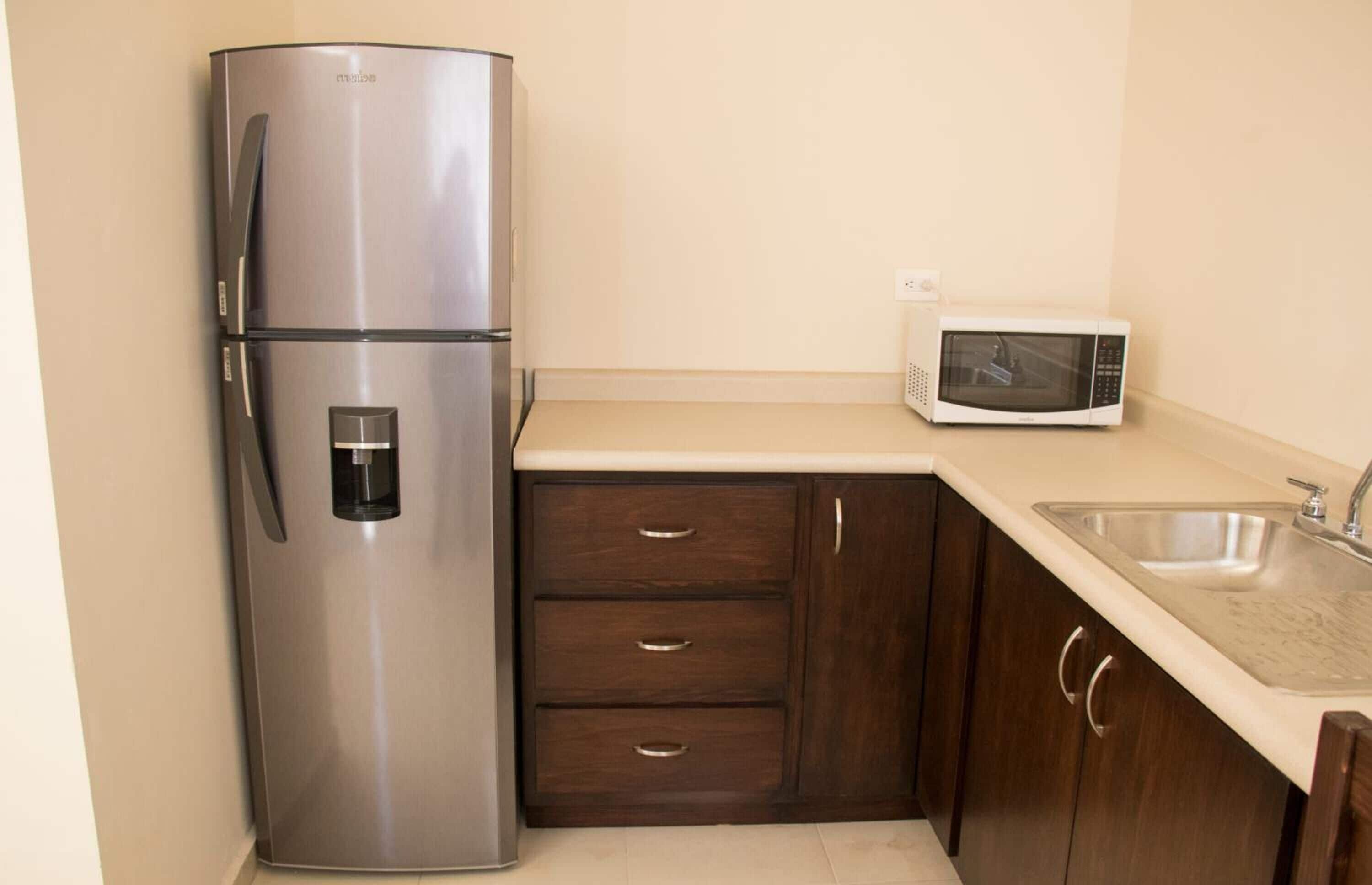 Fridge, microwave, cookware/dishes/utensils