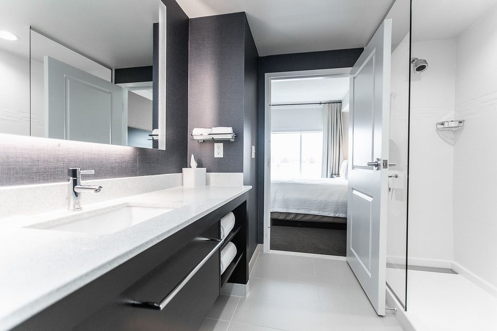 separate bathtub and shower, designer toiletries, hair dryer, towels