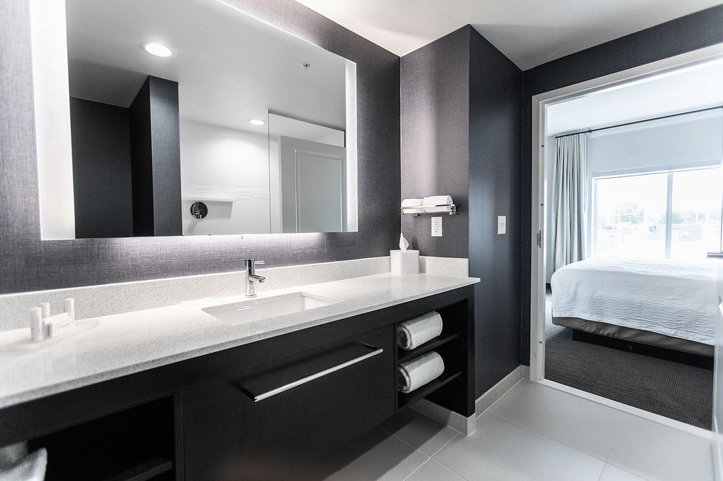 separate bathtub and shower, designer toiletries, hair dryer, towels