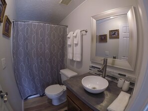 Shower, hair dryer, towels, shampoo