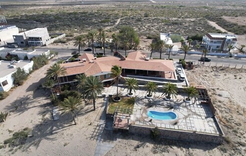 Beautiful beachfront 7 BR 6.5 BtR  colonial style estate on 30,000 sqft lot