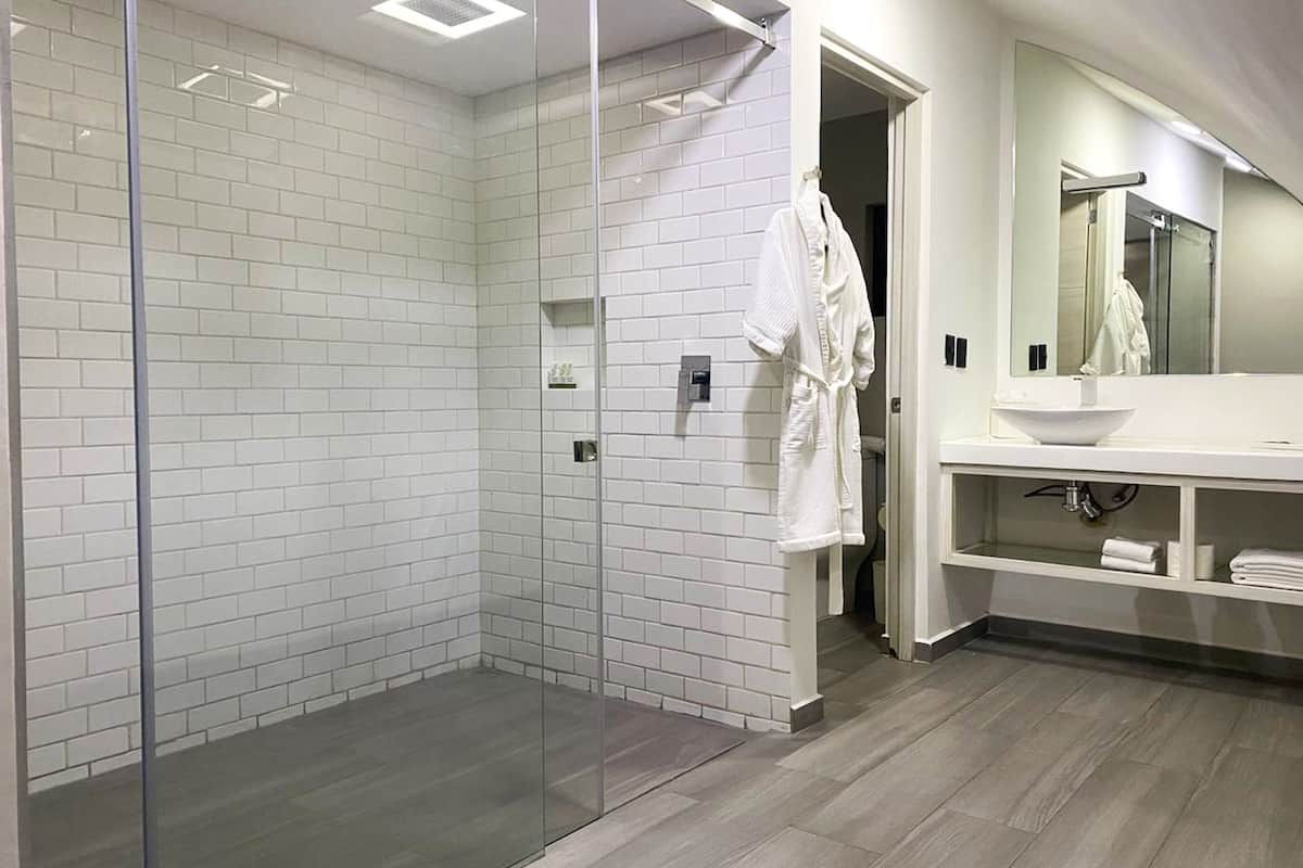 superior suite, 1 king bed, non smoking | bathroom | shower, rainfall showerhead, free toiletries, hair dryer