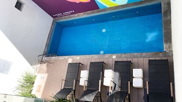 Seasonal outdoor pool, open 9:00 AM to 9:00 PM, sun loungers