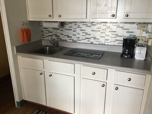 Fridge, microwave, stovetop, coffee/tea maker