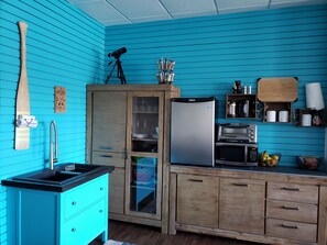 Fridge, microwave, stovetop, coffee/tea maker