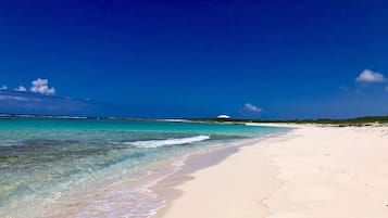 On the beach, sun loungers, beach towels