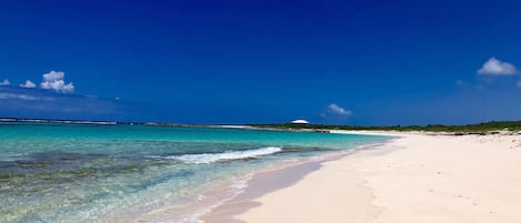 On the beach, sun-loungers, beach towels