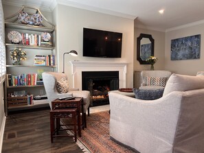 TV, fireplace, books