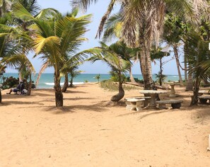 On the beach, sun loungers, beach towels