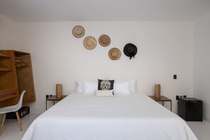 Suite Deluxe | Sábanas de algodón egipcio, ropa de cama de alta calidad y minibar 