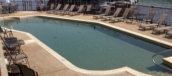Relax on your screened in balcony overlooking the Lake. Two Golf Courses nearby.