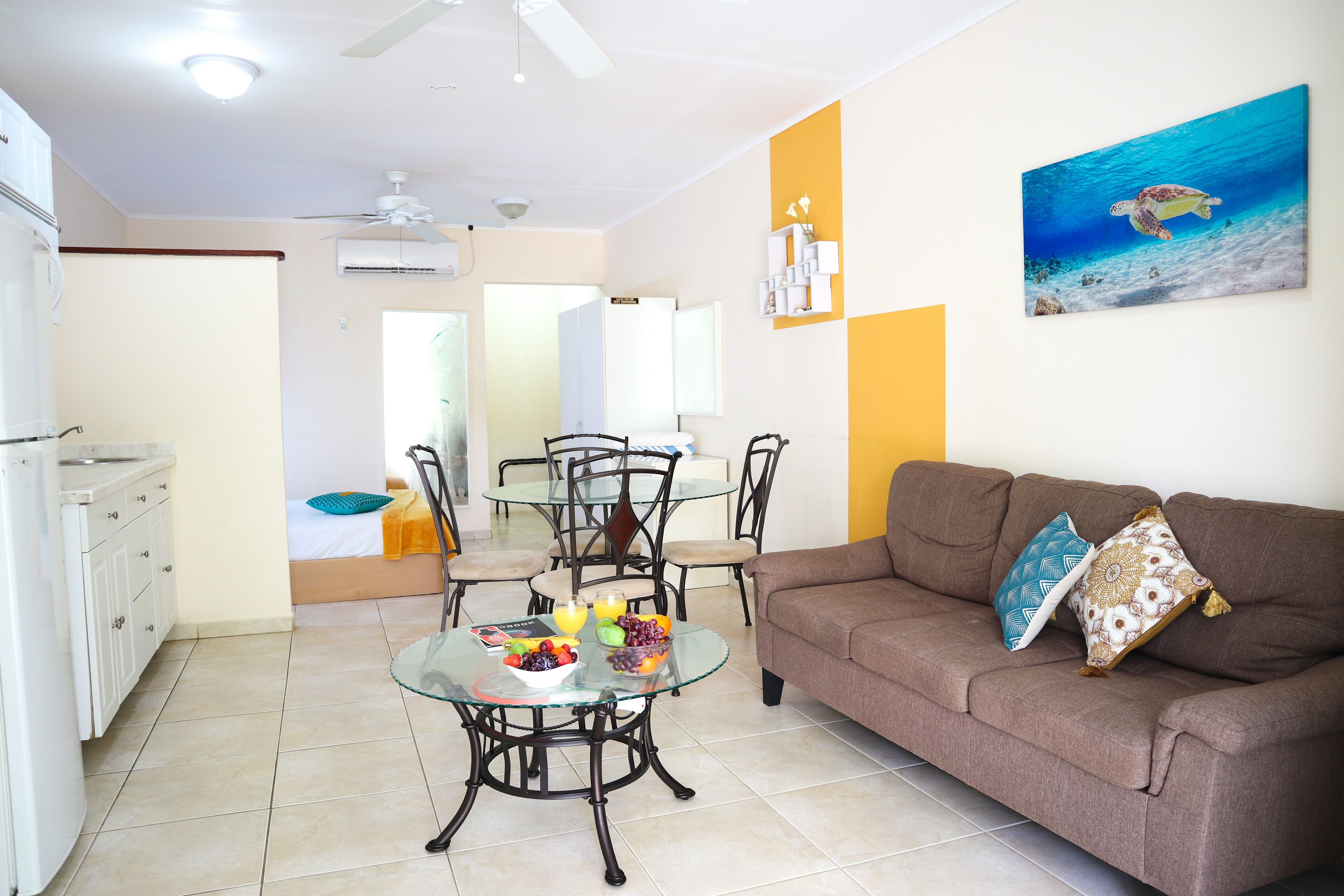 deluxe studio suite | living area | 32-inch flat-screen tv with cable channels, tv, heated floors