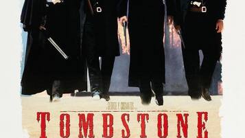 A movie poster for 'Tombstone' with four characters, each holding a gun.