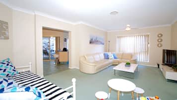 Family House, 5 Bedrooms, Garden View | Living area | 55-inch LCD TV with satellite channels, TV, Netflix